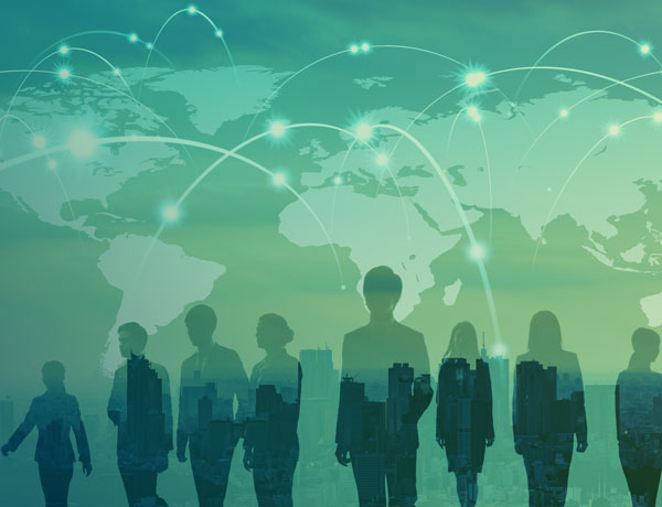 Silhouettes of people over a city skyline, with a digital world map showing glowing connection lines, symbolizing global connectivity and communication.