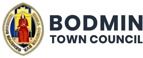 Bodmin Town Council logo featuring a medieval-style illustration of a seated person in red, framed with gold, next to the council's name in blue.