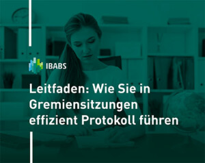 A person is working at a desk. The image highlights a guide for efficient meeting minutes in German, featuring the IBABS logo.