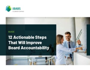 Two people smiling and discussing in an office setting. Text reads: "12 Actionable Steps That Will Improve Board Accountability." iBABS logo displayed.